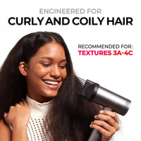 Smiling model using TYMO AIRHYPE comb nozzle as a straightener combo for curly and coily textures