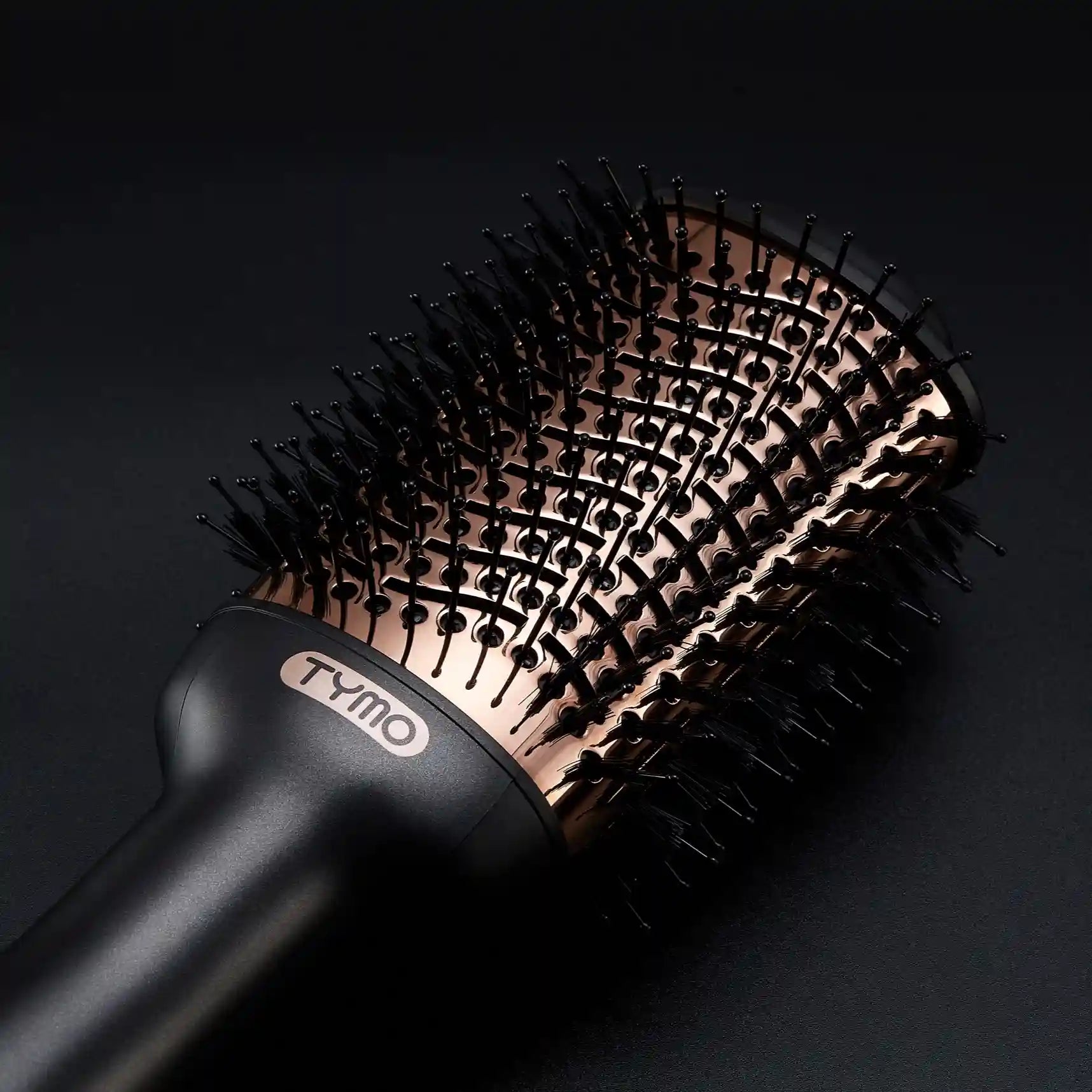 Close-up of TYMO VOLUMIZER hot air brush highlighting its unique bristle design.
