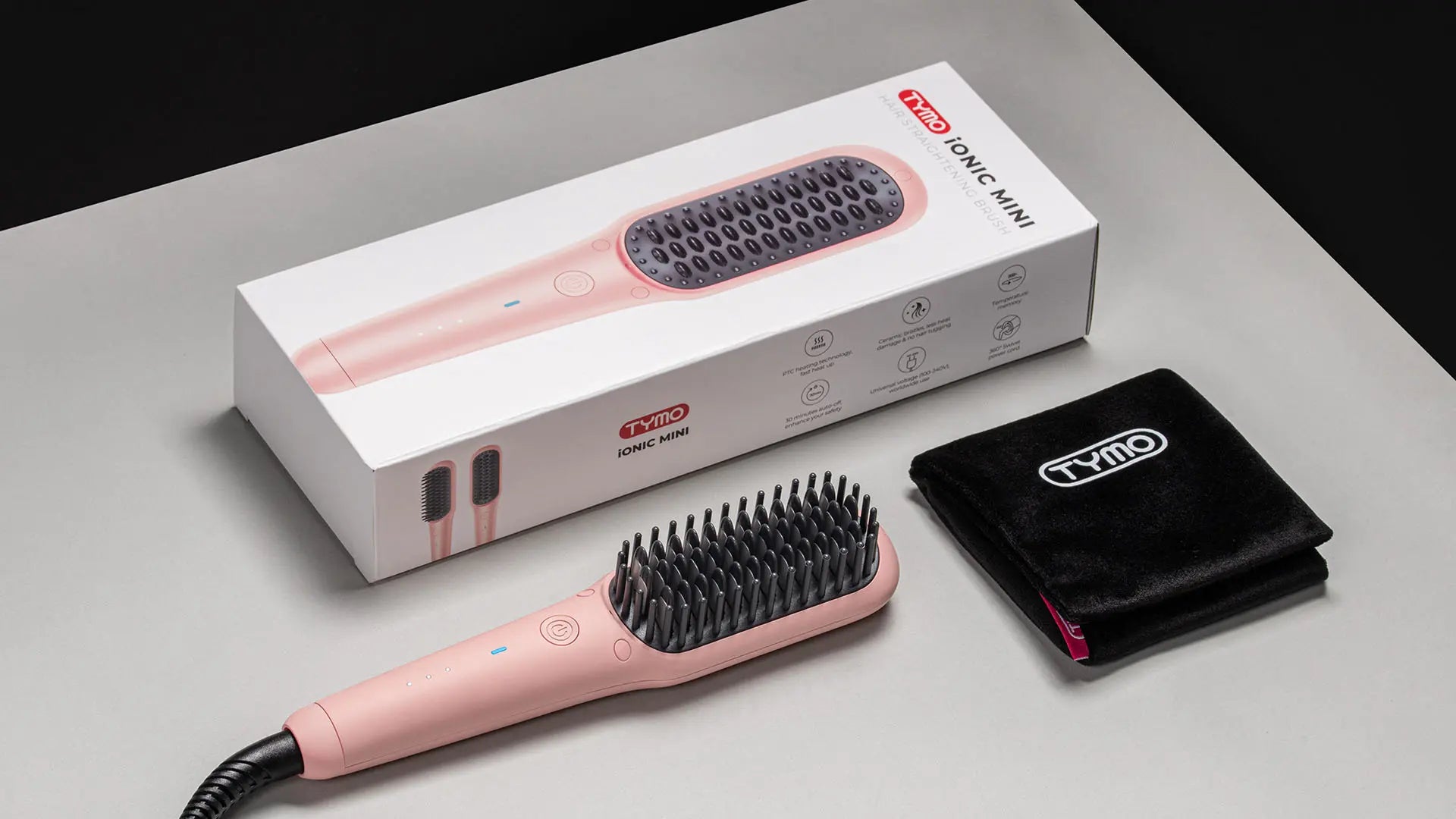 Complete set of TYMO iONIC MINI PINK electric curling brush with accessories.