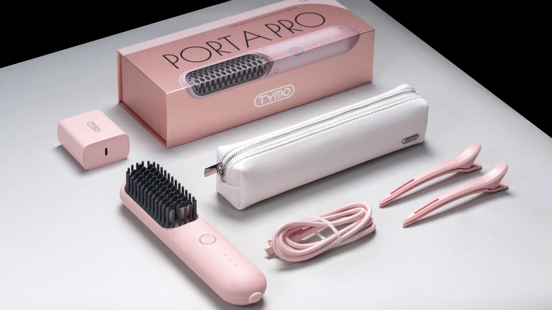 TYMO PORTA PRO PINK electric hair brush with an upgraded ionic system, effectively tames frizzy hair.