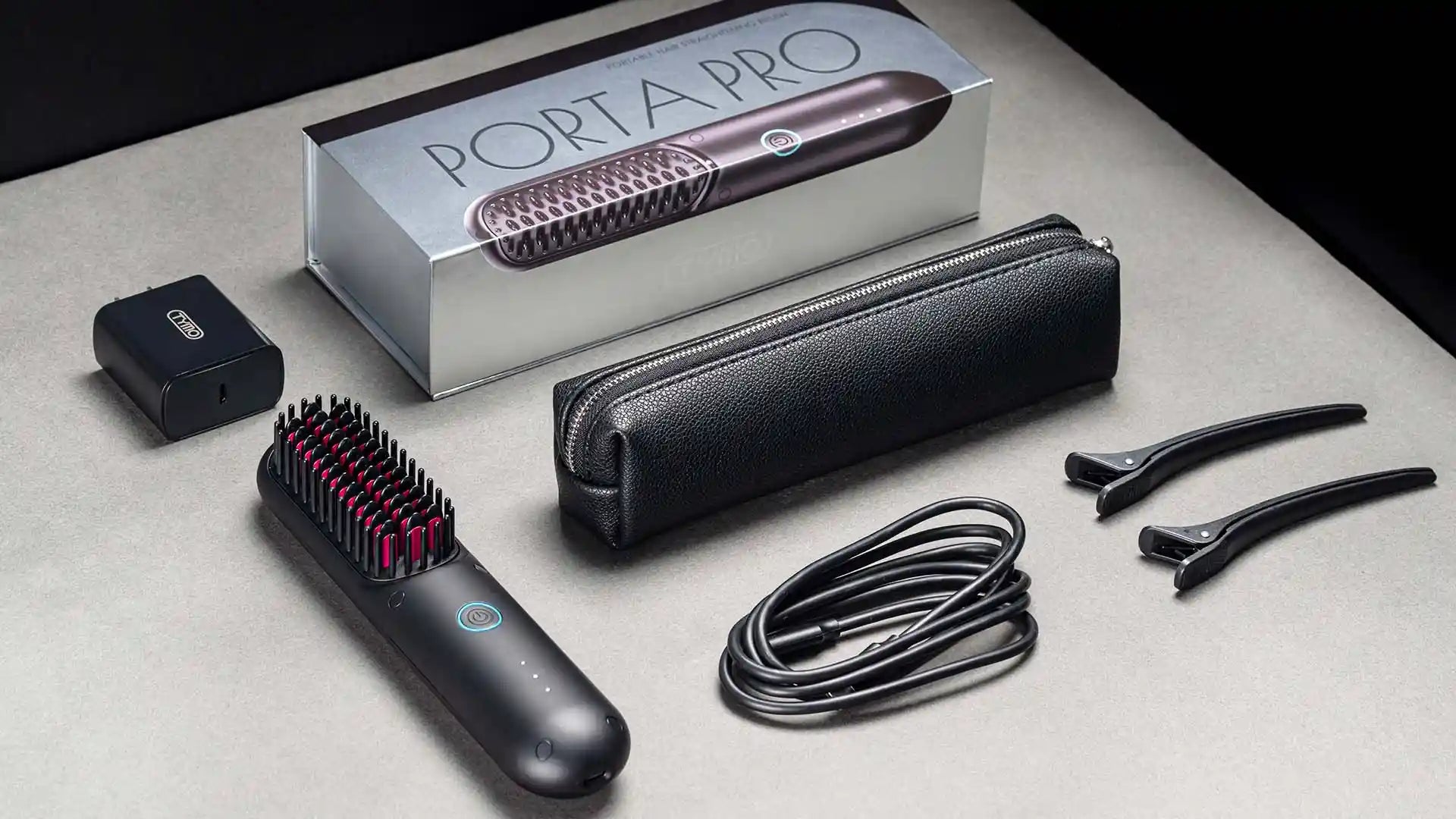 TYMO PORTA PRO hair styler packaging, including hair straightener, carrying case, charging adapter, and accessories.