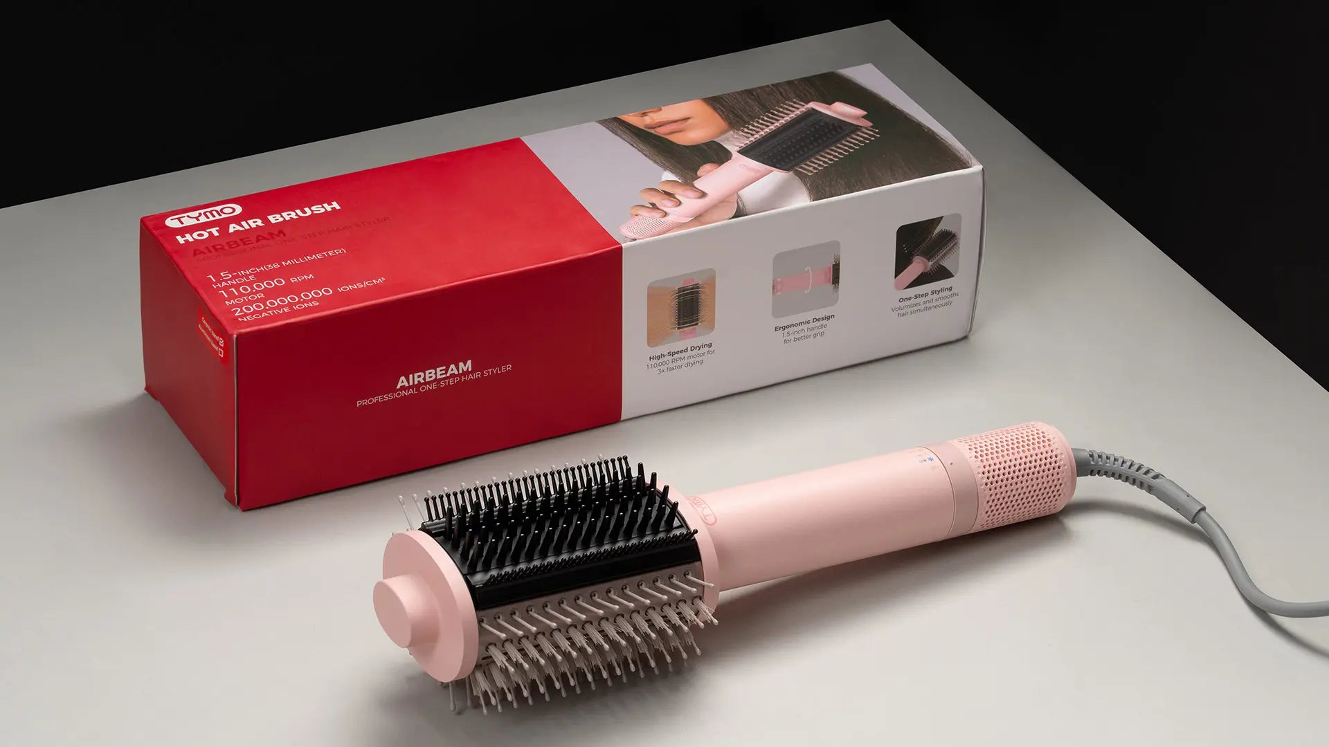 Compact and lightweight TYMO AIRBEAM blowout heated brush with 3-in-1 brush design.