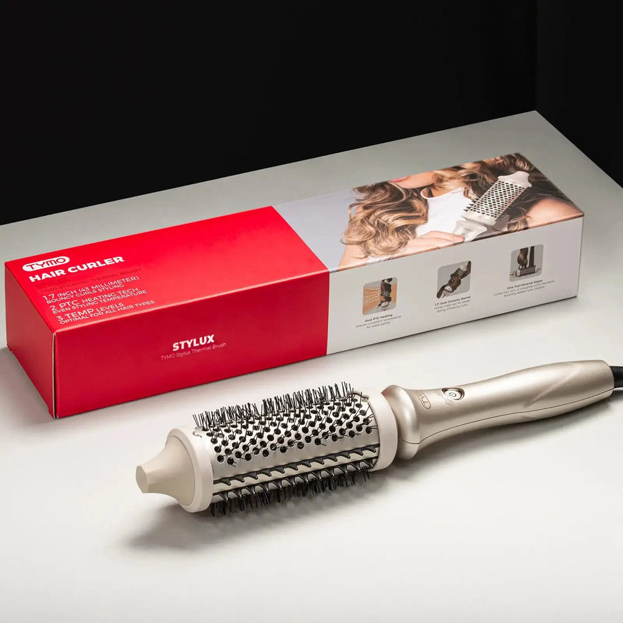 Retail-packed TYMO STYLUX hair brush with full round barrel and dense bristles