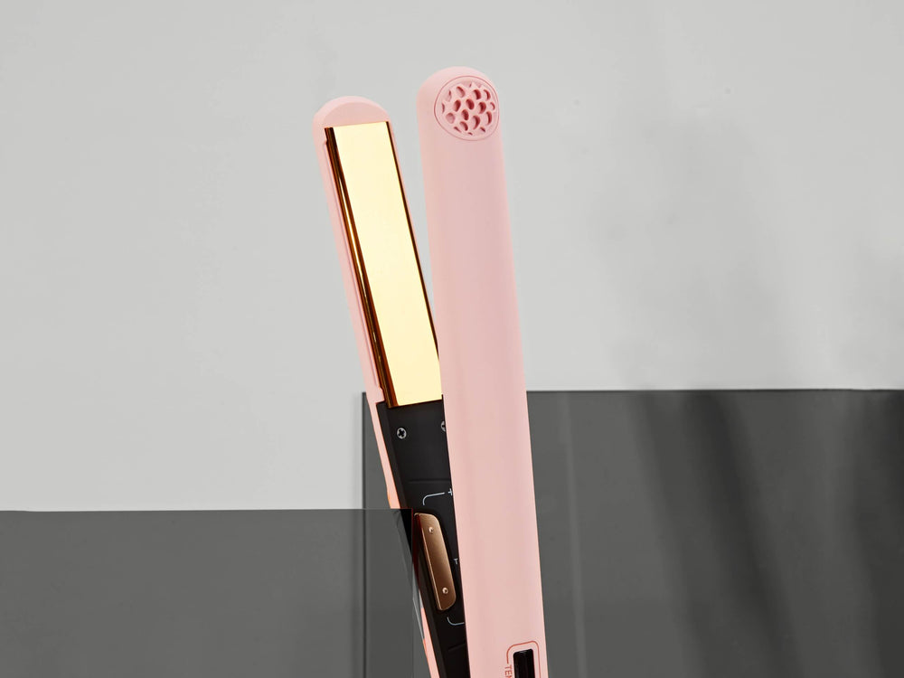Elegant TYMO SWAY hair straightener with gold-plated plates, designed for creating sleek hairstyles with ease.