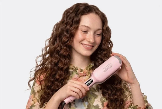 Woman creating modern crimped hair with a pink TYMO hair waver
