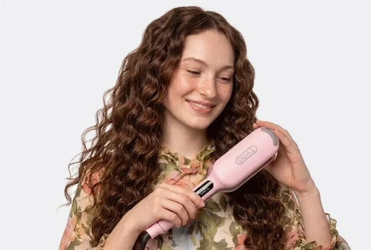 Woman creating modern crimped hair with a pink TYMO hair waver