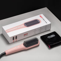 
                  
                    TYMO iONIC MINI PINK product packaging and contents including the pink mini heat brush.
                  
                