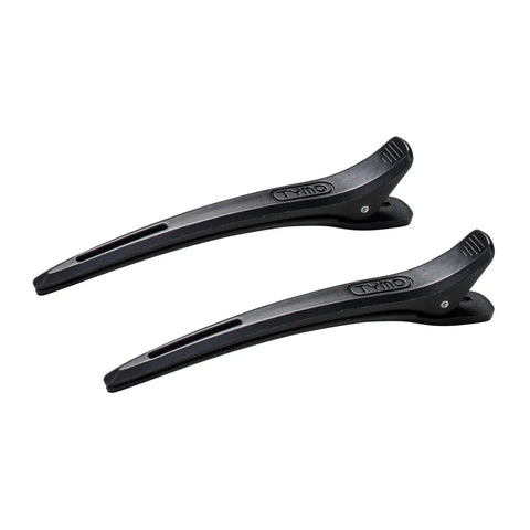 Two black TYMO professional styling hair clips with a patented non-slip grip design and embossed logo, displayed at an angle against a white background.