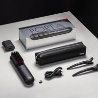 
                  
                    Complete packaging of TYMO PORTA cordless hair straightener with accessories including USB cable and travel pouch.
                  
                